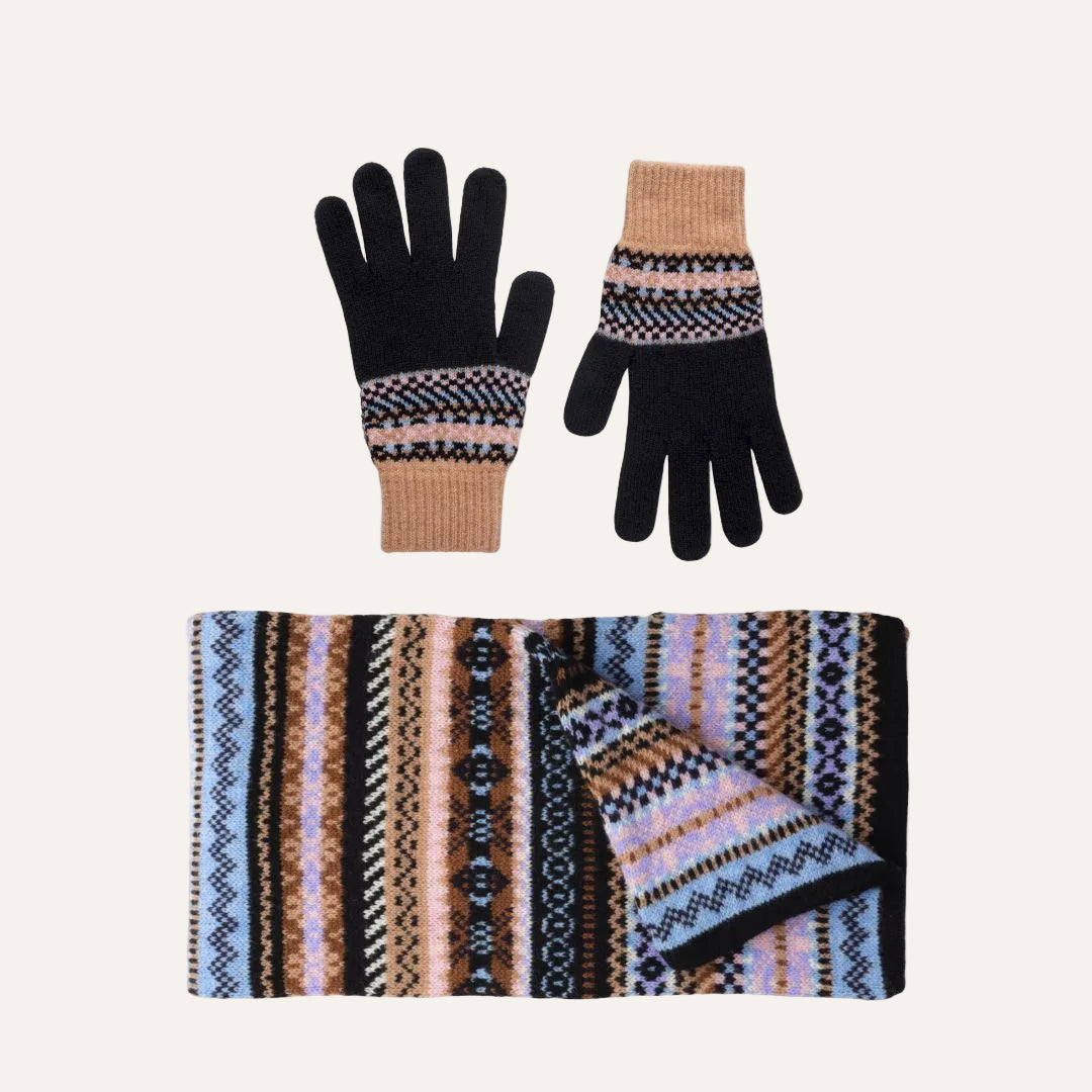 Lambswool knit winter accessory set on a white background, including a pair of gloves and a matching scarf. The gloves are primarily black with beige cuffs and a multicolor geometric pattern band.
