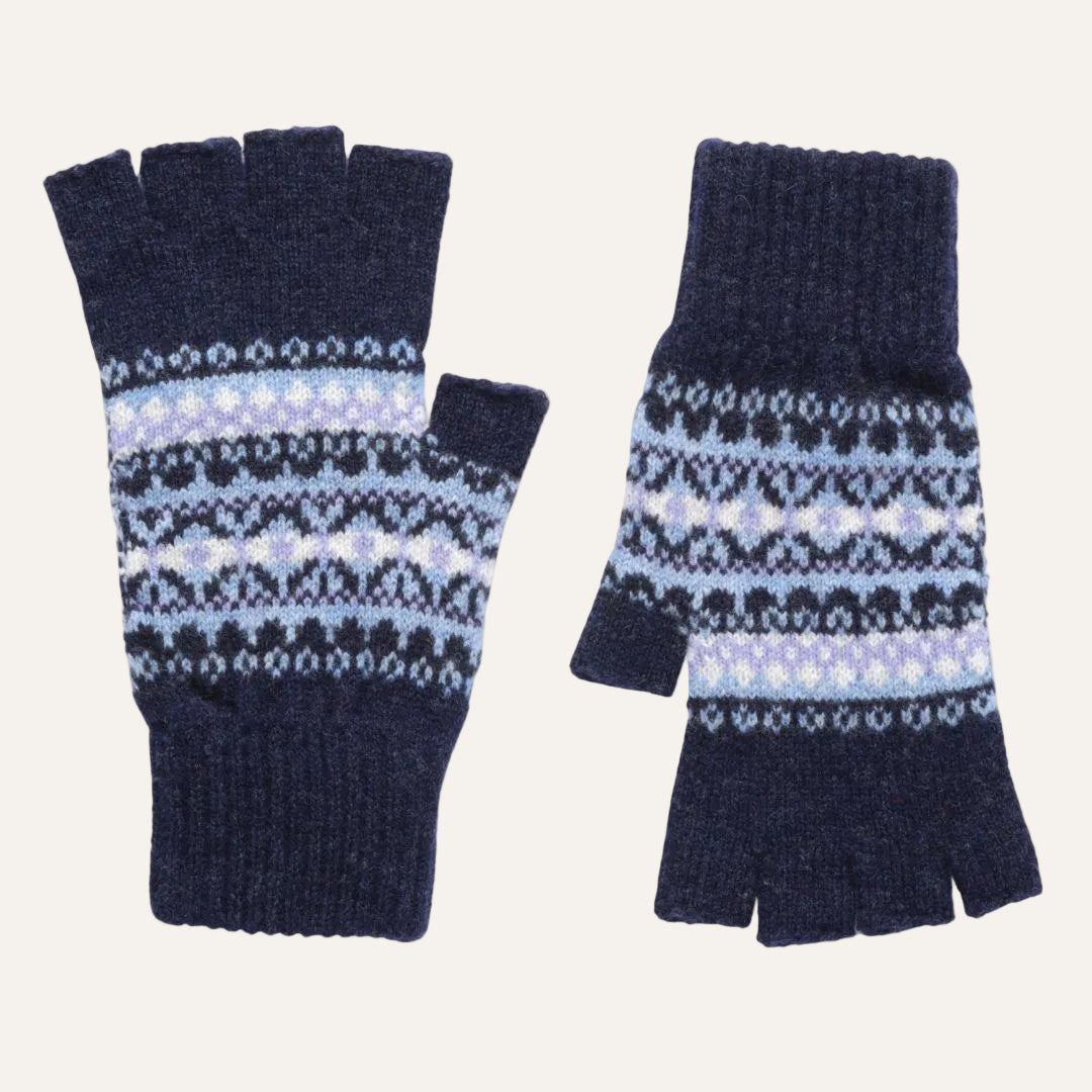 A pair of navy blue knit lambswool fingerless gloves with a light blue and white Fair Isle patterned band across the middle.