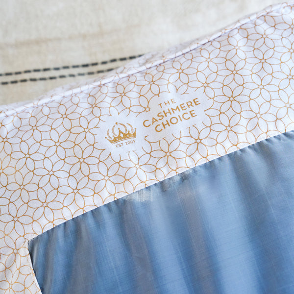Close-up of cotton storage bag for knitwear. 'The Cashmere Choice' branding.