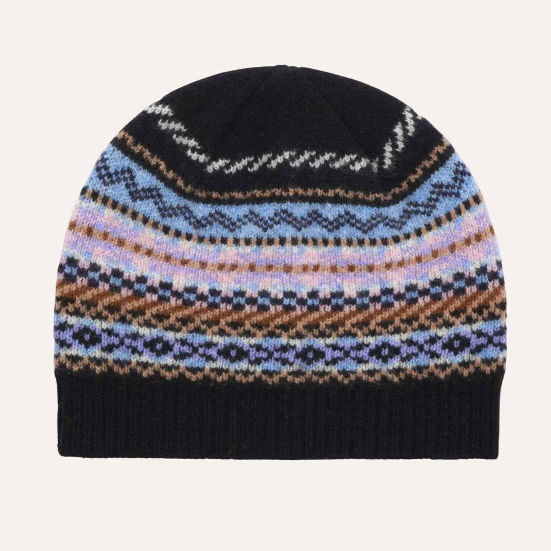 A knit beanie hat featuring a black ribbed top and bottom with a multicolor Fair Isle pattern band in the middle, showcasing shades of blue, purple, brown, and white.