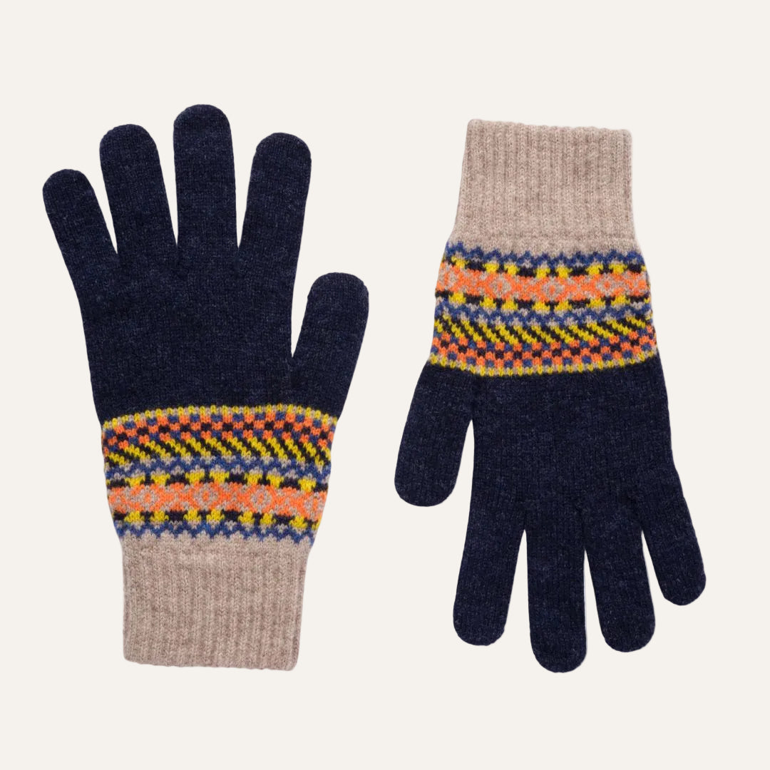 A pair of knit winter gloves shown flat against a white background. The gloves are dark navy blue with a beige ribbed cuff and a multicolor Fair Isle pattern band in orange, yellow, and blue.