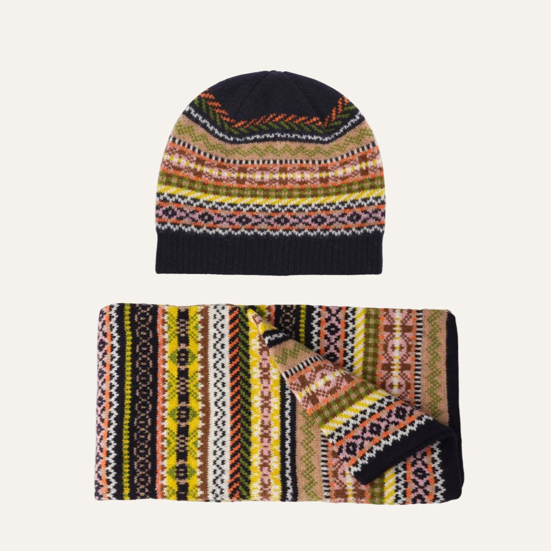Lambswool knit beanie and matching scarf set with a multicolor Fair Isle pattern on a solid white background.
