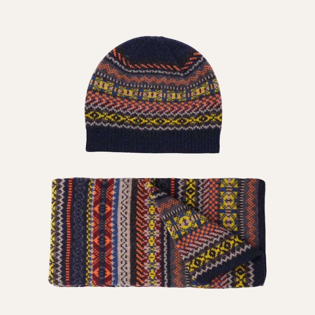 Lambswool knit beanie and matching neck warmer set with a multicolor Fair Isle pattern on a white background.