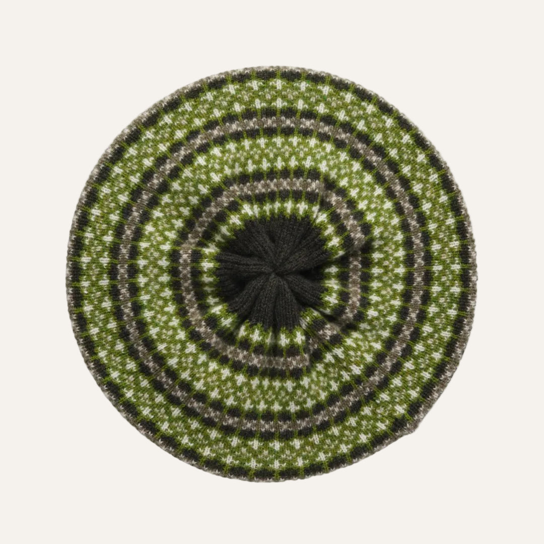 A round knit beret hat with a concentric Fair Isle pattern in olive green, dark green, and gray.